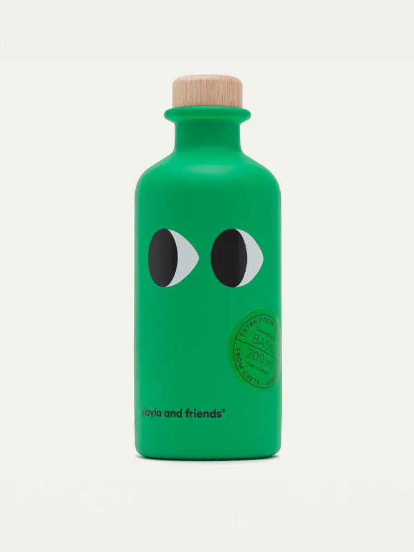 A bottle of Yiayia & Friends Extra Virgin Olive Oil infused with basil, offering a fragrant and fresh herbal flavor, perfect for enhancing salads, pasta dishes, and more.