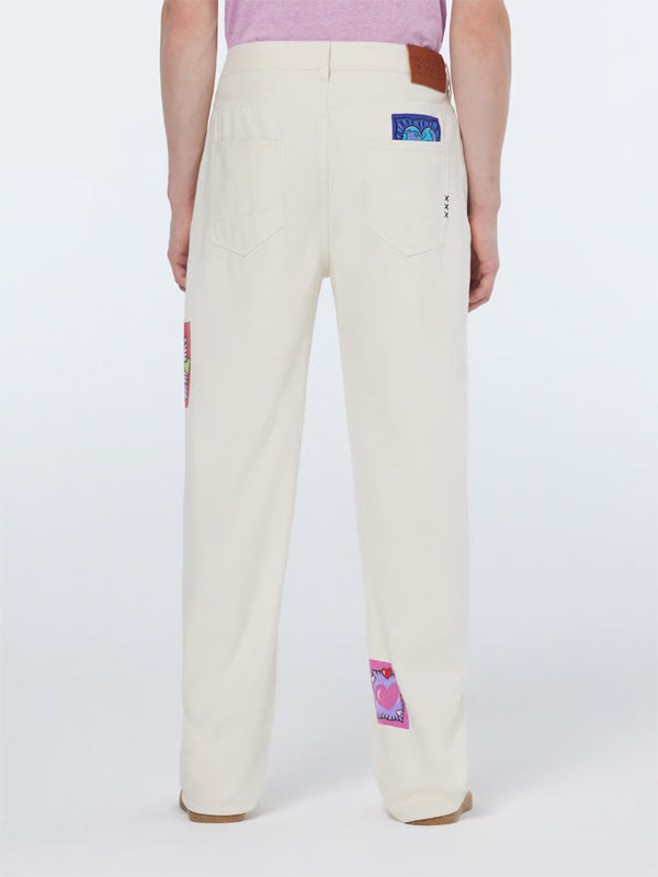Burton Morris Straight Leg Jeans: Ecru Love – A timeless denim silhouette featuring a soft ecru wash with artistic flair.