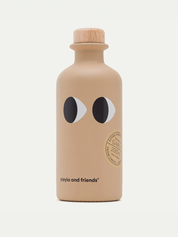 A bottle of Yiayia Garlic Infused Olive Oil, offering a rich and aromatic flavor with a perfect balance of garlic and premium extra virgin olive oil, ideal for cooking or drizzling over dishes.