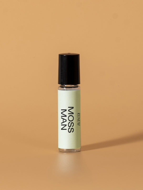 A roll-on bottle of Moss Man oil, offering a fresh and earthy scent, perfect for a natural fragrance experience with a subtle, woodland-inspired aroma.