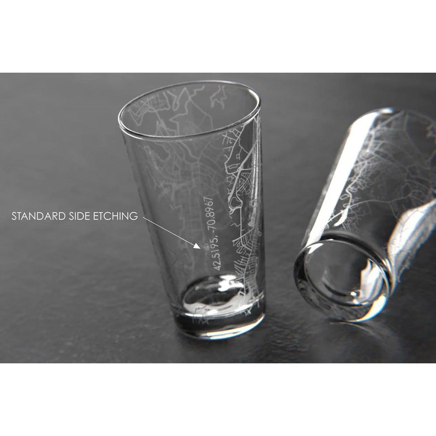 Pint glass featuring a detailed map of Raleigh, North Carolina, with streets, landmarks, and neighborhoods outlined, showcasing the city's layout.