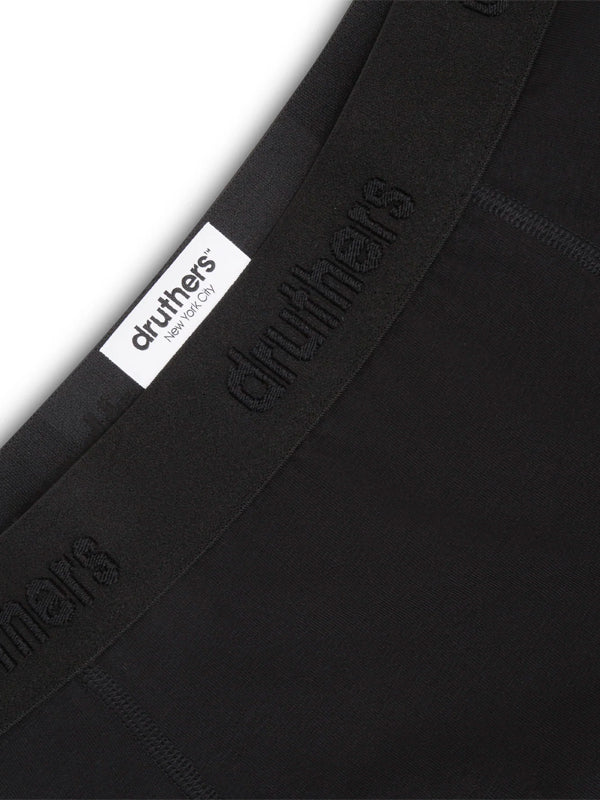 Black organic cotton boxer briefs with a soft, breathable fabric and a comfortable, snug fit.
