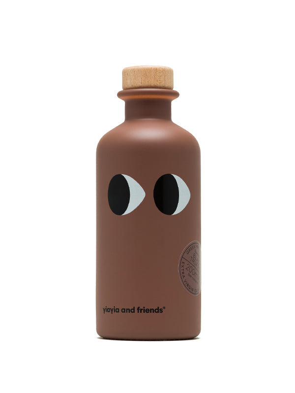 Premium Yiayia & Friends extra virgin olive oil infused with rich, earthy black truffle, perfect for enhancing gourmet dishes with a luxurious depth of flavor.