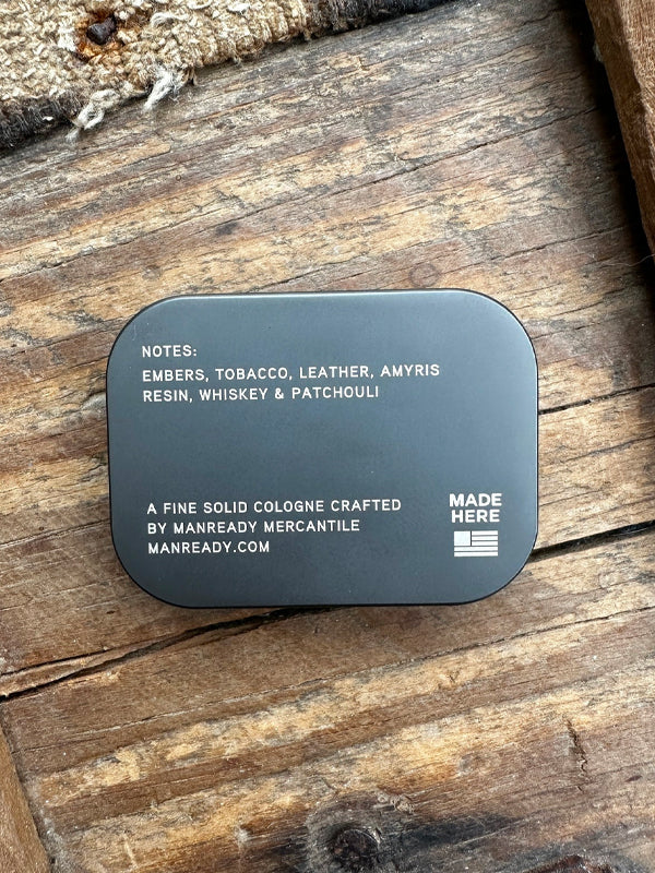 Solid cologne in Cade, featuring a rugged, smoky aroma with woody and herbal notes, perfect for a subtle and long-lasting scent on the go.