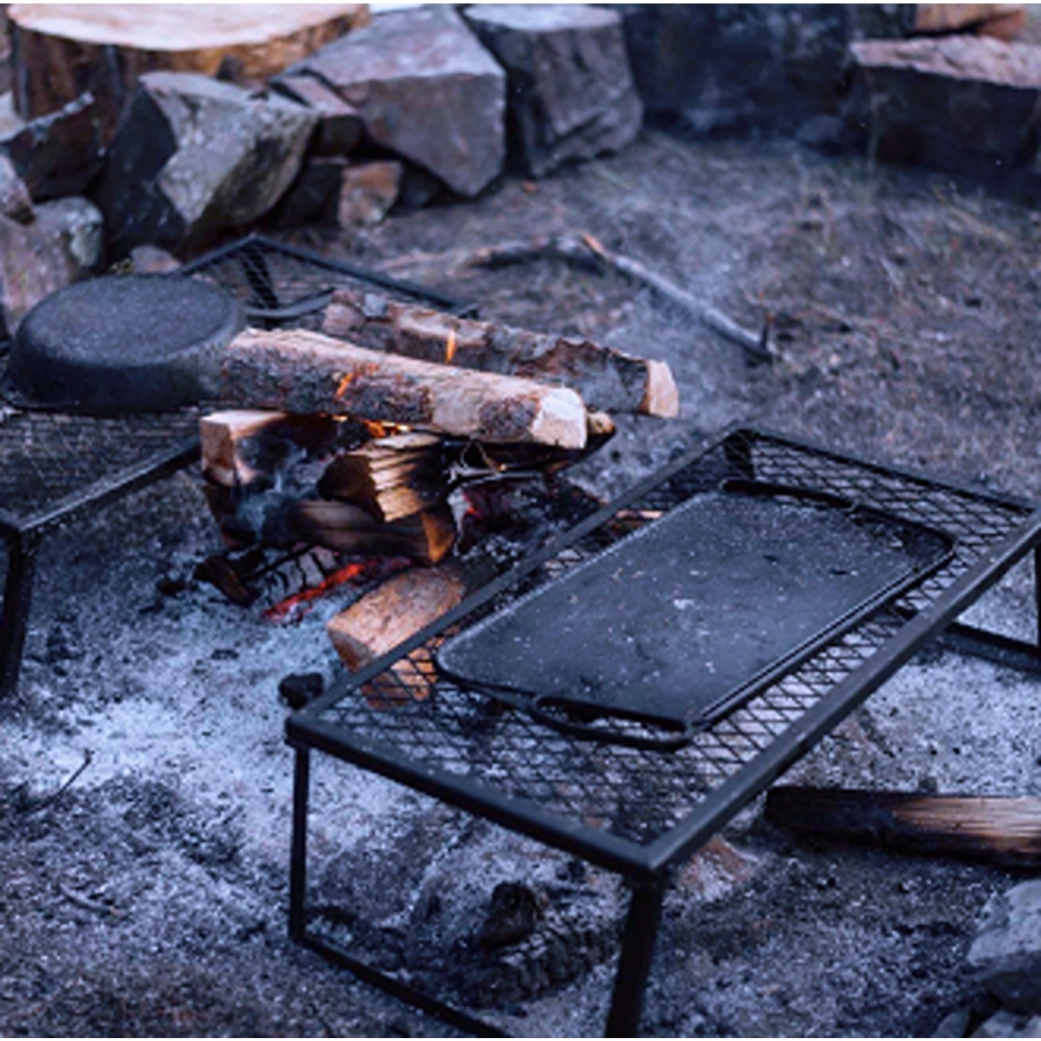 A sturdy Cast Iron Griddle, perfect for evenly cooking a variety of dishes, from pancakes to grilled sandwiches, with excellent heat retention and a long-lasting, durable design.