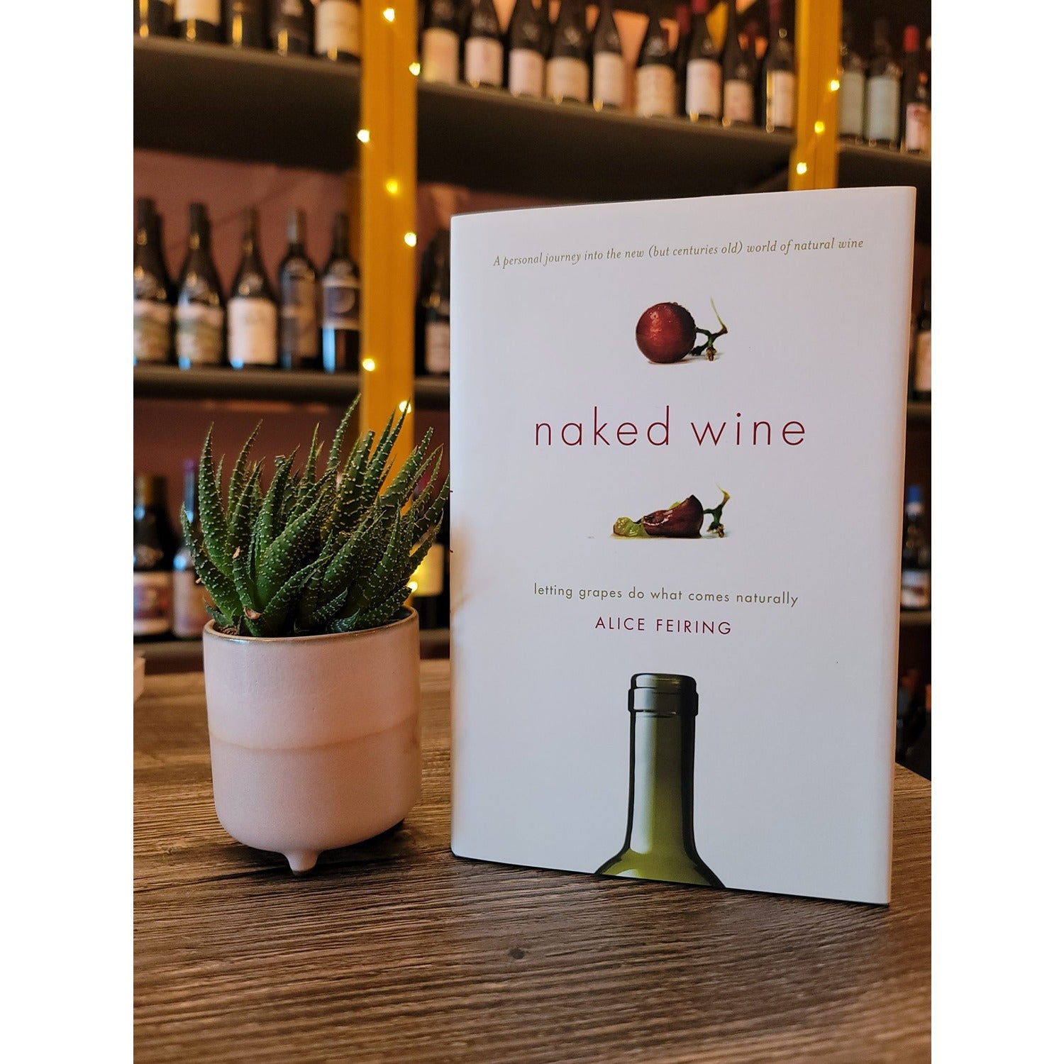The book Naked Wine: Letting Grapes Do What Comes Naturally by Alice Feiring, exploring the world of natural wines, focusing on organic, biodynamic, and sustainable practices that allow the grapes to express their true character.
