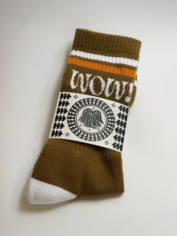 Pair of olive-green socks with the word 'Wow!' embroidered in bold, stylish lettering.
