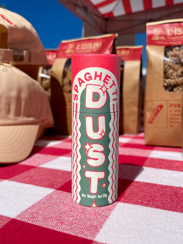 A jar of Spaghetti Dust, a flavorful seasoning blend designed to add a burst of savory spices to your pasta dishes, enhancing the taste of spaghetti or any favorite Italian meal.