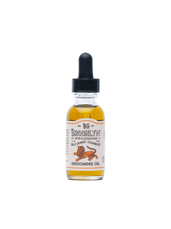 Invigorating grooming oil infused with wild orange and cedarwood, offering a refreshing citrus aroma balanced with warm, earthy notes for deep nourishment and hydration.